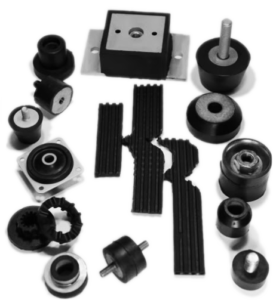 Karman Rubber logo surrounded by custom elastomer parts